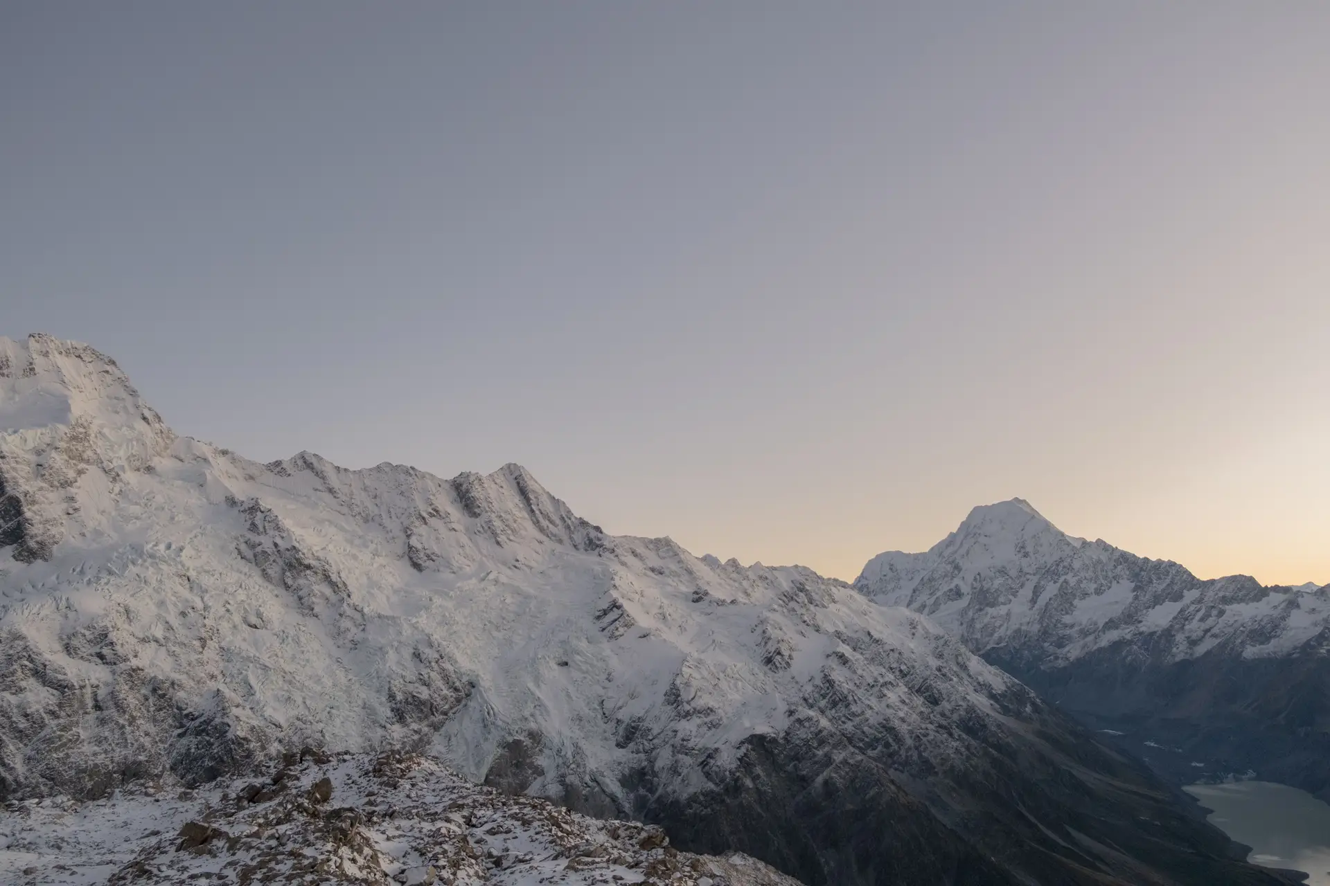Alpine light at dawn reflecting off snow-covered peaks