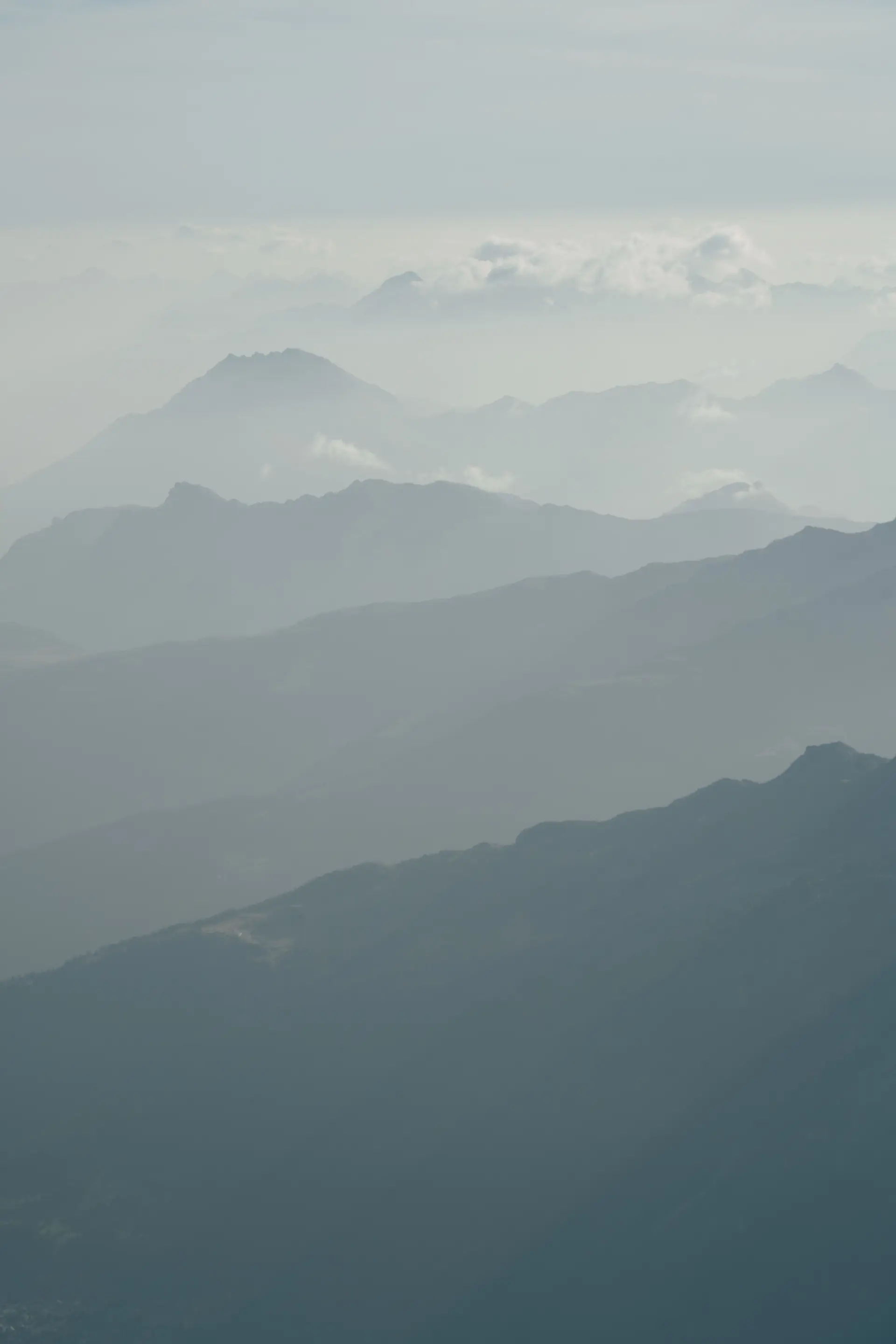 Alpine mountains enveloped in mist